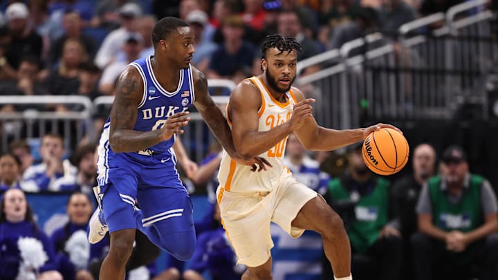 Mar 18, 2023; Orlando, FL, USA; Tennessee Volunteers guard Josiah-Jordan James (30) dribbles past Duke Blue Devils forward Dariq Whitehead (0) during the second half in the second round of the 2023 NCAA Tournament at Legacy Arena. Mandatory Credit: Matt Pendleton-Imagn Images