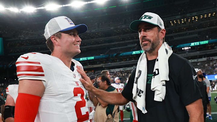 Aug 24, 2024; East Rutherford, New Jersey, USA; New York Jets quarterback Aaron Rodgers (8) talks with New York Giants quarterback Drew Lock (2) after the game at MetLife Stadium. Mandatory Credit: Vincent Carchietta-Imagn Images