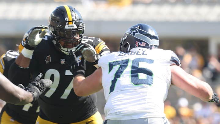 Sep 14, 2025; Pittsburgh, Pennsylvania, USA;  Pittsburgh Steelers defensive tackle Cameron Heyward (97) pass rushes at the line of scrimmage against Seattle Seahawks guard Grey Zabel (76) during the third quarter at Acrisure Stadium. Mandatory Credit: Charles LeClaire-Imagn Images