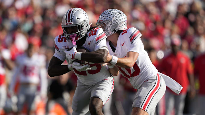 Oct 18, 2025; Madison, Wisconsin, USA; Ohio State Buckeyes quarterback Julian Sayin (10) hands the ball off to running back Bo Jackson (25) in the first quarter against the Wisconsin Badgers at Camp Randall Stadium. Mandatory Credit: Jeff Hanisch-Imagn Images Oct 18, 2025; Madison, Wisconsin, USA; Ohio State Buckeyes quarterback Julian Sayin (10) hands the ball off to running back Bo Jackson (25) in the first quarter against the Wisconsin Badgers at Camp Randall Stadium. Mandatory Credit: Jeff Hanisch-Imagn Images