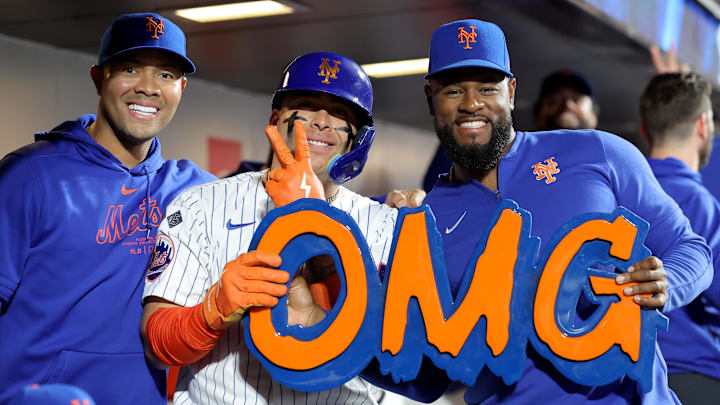 Sep 17, 2024; New York City, New York, USA; New York Mets catcher Francisco Alvarez (4) celebrates his solo home run against the Washington Nationals with starting pitchers Jose Quintana (62) and Luis Severino (40) during the fourth inning at Citi Field. Mandatory Credit: Brad Penner-Imagn Images