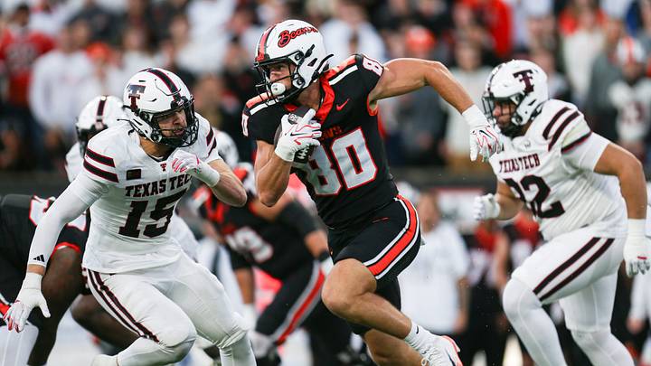 Oregon State's Eric Olsen (80) runs away from Texas Tech defenders during an NCAA football game at Reser Stadium on Saturday, Sept. 12, 2026, in Corvallis, Oregon Oregon State's Eric Olsen (80) runs away from Texas Tech defenders during an NCAA football game at Reser Stadium on Saturday, Sept. 12, 2026, in Corvallis, Oregon