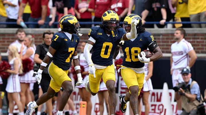 Sep 12, 2026; Ann Arbor, Michigan, USA; Michigan Wolverines cornerback Jyaire Hill (0) celebrates with teammates after an interception against the Oklahoma Sooners during the fourth quarter at Michigan Stadium. Mandatory Credit: Lon Horwedel-Imagn Images Sep 12, 2026; Ann Arbor, Michigan, USA; Michigan Wolverines cornerback Jyaire Hill (0) celebrates with teammates after an interception against the Oklahoma Sooners during the fourth quarter at Michigan Stadium. Mandatory Credit: Lon Horwedel-Imagn Images