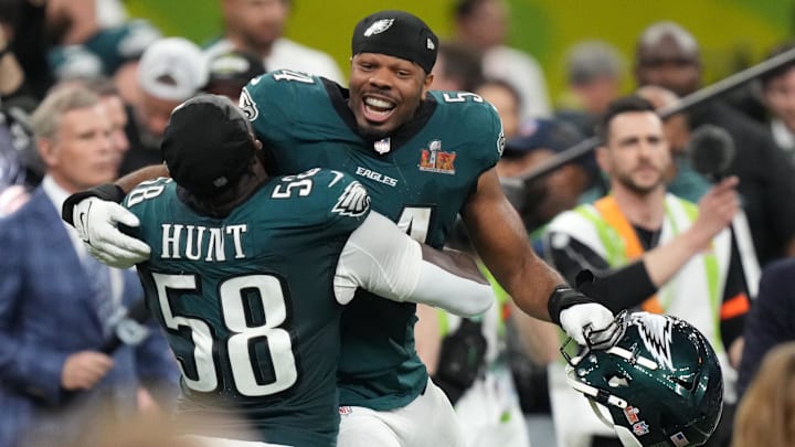 Feb 9, 2025; New Orleans, LA, USA; Philadelphia Eagles linebacker Jeremiah Trotter Jr. (54) reacts with linebacker Jalyx Hunt (58) after defeating the Kansas City Chiefs in Super Bowl LIX at Caesars Superdome. Mandatory Credit: Kirby Lee-Imagn Images