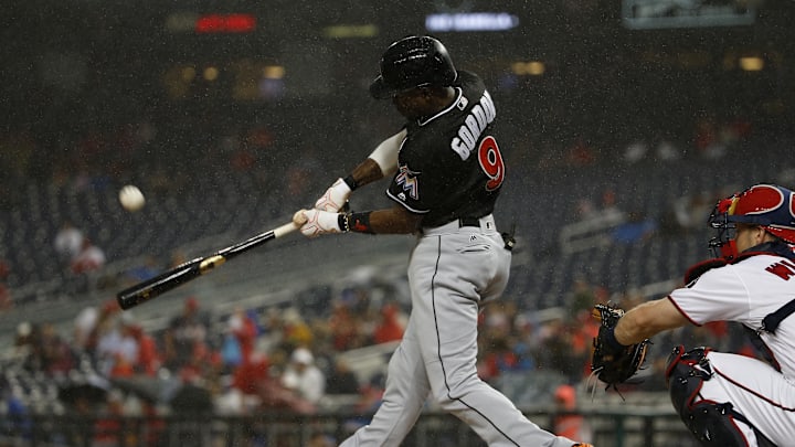 Aug 29, 2017; Washington, DC, USA; Miami Marlins second baseman Dee Gordon (9) hits a single against the Washington Nationals during the first inning at Nationals Park. Mandatory Credit: Amber Searls-Imagn Images Aug 29, 2017; Washington, DC, USA; Miami Marlins second baseman Dee Gordon (9) hits a single against the Washington Nationals during the first inning at Nationals Park. Mandatory Credit: Amber Searls-Imagn Images
