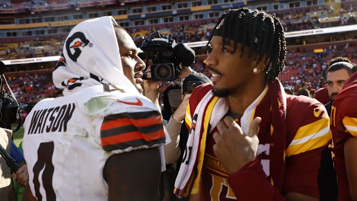 Oct 6, 2024; Landover, Maryland, USA; Washington Commanders quarterback Jayden Daniels (5) talks with Cleveland Browns quarterback Deshaun Watson (4) after their game at NorthWest Stadium. Mandatory Credit: Geoff Burke-Imagn Images