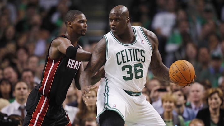 Oct 26, 2010; Boston, MA, USA; Boston Celtics center Shaquille O'Neal (36) works the ball during the first half against Miami Heat forward Chris Bosh (left) at the TD Garden. Mandatory Credit: David Butler II-Imagn Images