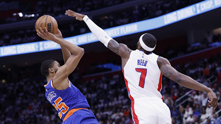 May 1, 2025; Detroit, Michigan, USA; New York Knicks forward Mikal Bridges (25) shoots on Detroit Pistons forward Paul Reed (7) in the first half during game six of first round for the 2024 NBA Playoffs at Little Caesars Arena. Mandatory Credit: Rick Osentoski-Imagn Images