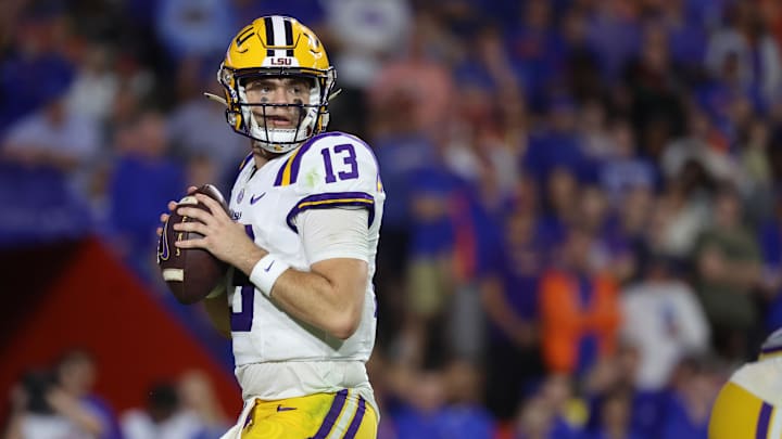 Nov 16, 2024; Gainesville, Florida, USA; LSU Tigers quarterback Garrett Nussmeier (13) drops back against the Florida Gators during the second half at Ben Hill Griffin Stadium. Mandatory Credit: Kim Klement Neitzel-Imagn Images Nov 16, 2024; Gainesville, Florida, USA; LSU Tigers quarterback Garrett Nussmeier (13) drops back against the Florida Gators during the second half at Ben Hill Griffin Stadium. Mandatory Credit: Kim Klement Neitzel-Imagn Images