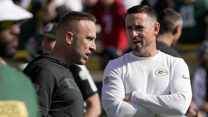Green Bay Packers defensive coordinator Jeff Hafley, left, talks with head coach Matt LaFleur before their game against the Houston Texans Sunday, October 20, 2024 at Lambeau Field in Green Bay, Wisconsin.