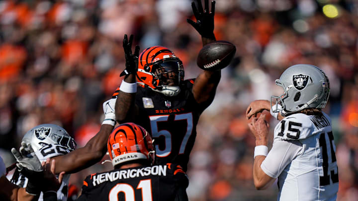 Cincinnati Bengals linebacker Germaine Pratt (57) pressures Las Vegas Raiders quarterback Gardner Minshew (15) as he throws in the first quarter of the NFL Week 9 game between the Cincinnati Bengals and the Las Vegas Raiders at Paycor Stadium in downtown Cincinnati on Sunday, Nov. 3, 2024.