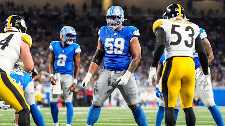 Detroit Lions offensive tackle Giovanni Manu (59) gets into position before a play against Pittsburgh Steelers during the first half of a preseason game at Ford Field in Detroit on Saturday, August 24, 2024.