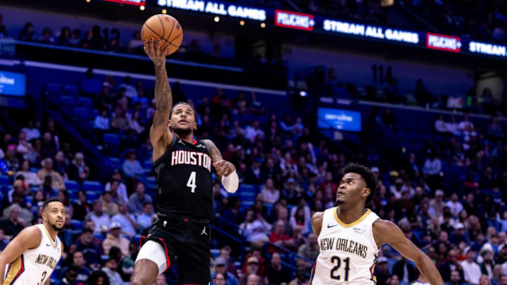 Dec 26, 2024; New Orleans, Louisiana, USA;  Houston Rockets guard Jalen Green (4) drives to the basket against New Orleans Pelicans center Yves Missi (21) during the first half at Smoothie King Center. Mandatory Credit: Stephen Lew-Imagn Images