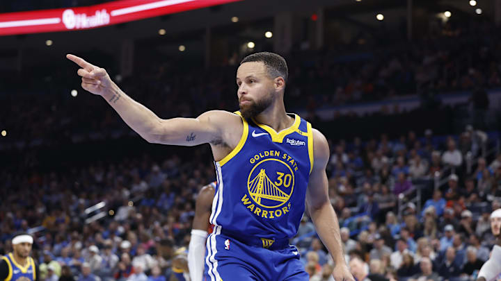 Golden State Warriors guard Stephen Curry (30) gestures after scoring a basket against the Oklahoma City Thunder during the second half at Paycom Center.