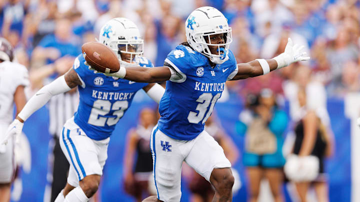 Sep 9, 2023; Lexington, Kentucky, USA; Kentucky Wildcats defensive back Maxwell Hairston (31) celebrates an interception during the second quarter against the Eastern Kentucky Colonels at Kroger Field. Mandatory Credit: Jordan Prather-Imagn Images Sep 9, 2023; Lexington, Kentucky, USA; Kentucky Wildcats defensive back Maxwell Hairston (31) celebrates an interception during the second quarter against the Eastern Kentucky Colonels at Kroger Field. Mandatory Credit: Jordan Prather-Imagn Images