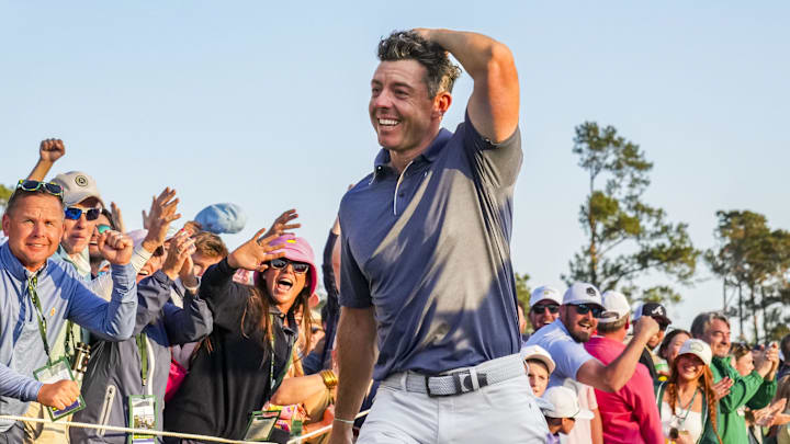 Rory McIlroy walks off the no. 18 green after winning a playoff during the final round of the Masters Tournament at Augusta National Golf Club.
