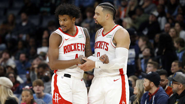Dec 15, 2023; Memphis, Tennessee, USA; Houston Rockets guard Jalen Green (4) reacts with forward Dillon Brooks (9) during the second half against the Memphis Grizzlies at FedExForum. Mandatory Credit: Petre Thomas-Imagn Images