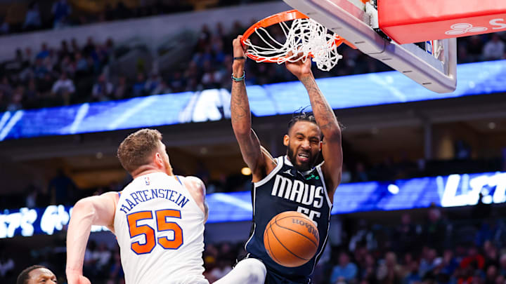 Jan 11, 2024; Dallas, Texas, USA;  Dallas Mavericks forward Derrick Jones Jr. (55) dunks the ball past New York Knicks center Isaiah Hartenstein (55) during the second half at American Airlines Center. Mandatory Credit: Kevin Jairaj-USA TODAY Sports