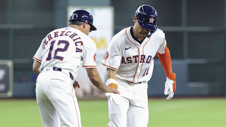 Jun 28, 2025; Houston, Texas, USA; Houston Astros right fielder Cam Smith (11) celebrates with third base coach Tony Perezchica (12) after hitting a home run during the second inning against the Chicago Cubs at Daikin Park