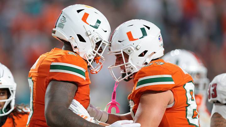 Nov 15, 2025; Miami Gardens, Florida, USA; Miami Hurricanes tight end Elija Lofton (9) celebrates with tight end Alex Bauman (87) after scoring a touchdown against NC State Wolfpack during the third quarter at Hard Rock Stadium. Mandatory Credit: Sam Navarro-Imagn Images Nov 15, 2025; Miami Gardens, Florida, USA; Miami Hurricanes tight end Elija Lofton (9) celebrates with tight end Alex Bauman (87) after scoring a touchdown against NC State Wolfpack during the third quarter at Hard Rock Stadium. Mandatory Credit: Sam Navarro-Imagn Images