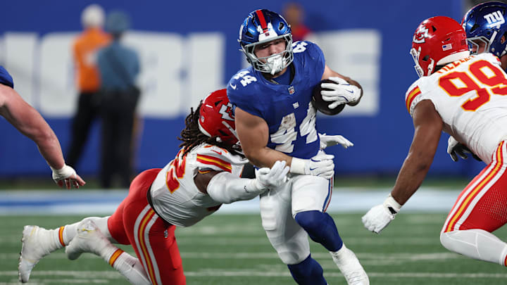 Sep 21, 2025; East Rutherford, New Jersey, USA; New York Giants running back Cam Skattebo (44) runs against Kansas City Chiefs linebacker Nick Bolton (32) in the second quarter at MetLife Stadium. Sep 21, 2025; East Rutherford, New Jersey, USA; New York Giants running back Cam Skattebo (44) runs against Kansas City Chiefs linebacker Nick Bolton (32) in the second quarter at MetLife Stadium.