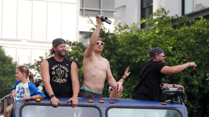 Nov 3, 2025; Los Angeles, CA, USA; Los Angeles Dodgers players Clayton Kershaw (left), Kike Hernandez (center) and Miguel Rojas ride on a double decker bus during the World Series championship parade Mandatory Credit: Kirby Lee-Imagn Images