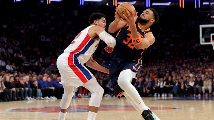 Apr 21, 2025; New York, New York, USA; New York Knicks center Karl-Anthony Towns (32) is fouled by Detroit Pistons forward Tobias Harris (12) as he drives to the basket during the second quarter of game two of the first round of the 2024 NBA Playoffs at Madison Square Garden. Mandatory Credit: Brad Penner-Imagn Images