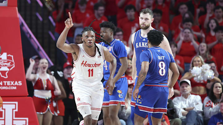Mar 3, 2025; Houston, Texas, USA; Houston Cougars forward Joseph Tugler (11) reacts after scoring a basket during the first half against the Kansas Jayhawks at Fertitta Center. Mandatory Credit: Troy Taormina-Imagn Images