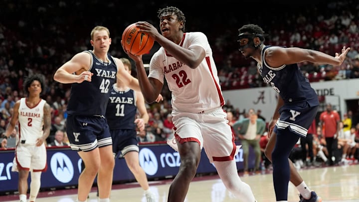 Dec 29, 2025; Tuscaloosa, AL, USA; Alabama forward Aiden Sherrell (22) drives to the basket between Yale forward Nick Townsend (42) and Yale forward Isaac Celiscar (8) at Coleman Coliseum. Mandatory Credit: Gary Cosby Jr.-Tuscaloosa News