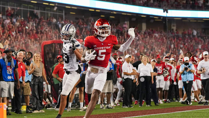 Sep 14, 2024; Houston, Texas, USA; Houston Cougars wide receiver Stephon Johnson (5) runs in a touchdown in the second quarter against the Rice Owls at TDECU Stadium. Mandatory Credit: Sean Thomas-Imagn Images