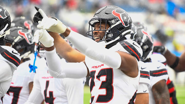 Jan 5, 2025; Nashville, Tennessee, USA; Houston Texans safety Eric Murray (23) celebrates his interception with the crowd against the Tennessee Titans during the first half. at Nissan Stadium. Mandatory Credit: Steve Roberts-Imagn Images Jan 5, 2025; Nashville, Tennessee, USA; Houston Texans safety Eric Murray (23) celebrates his interception with the crowd against the Tennessee Titans during the first half. at Nissan Stadium. Mandatory Credit: Steve Roberts-Imagn Images