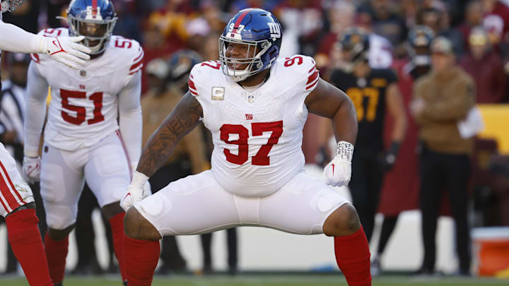 Nov 19, 2023; Landover, Maryland, USA; New York Giants defensive tackle Dexter Lawrence II (97) celebrates after a sack against the Washington Commanders during the second quarter at FedExField. Mandatory Credit: Geoff Burke-Imagn Images