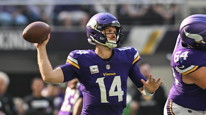 Oct 20, 2024; Minneapolis, Minnesota, USA; Minnesota Vikings quarterback Sam Darnold (14) throws a pass against the Detroit Lions during the first quarter at U.S. Bank Stadium. Mandatory Credit: Jeffrey Becker-Imagn Images
