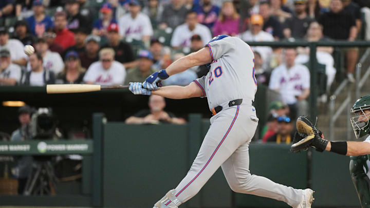 New York Mets first base Pete Alonso (20) hits a single against the Oakland Athletics during the first inning at Sutter Health Park on April 11.