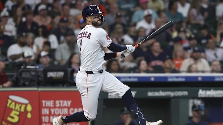 Sep 20, 2025; Houston, Texas, USA; Houston Astros third baseman Carlos Correa (1) hits a single during the first inning against the Seattle Mariners at Daikin Park. 