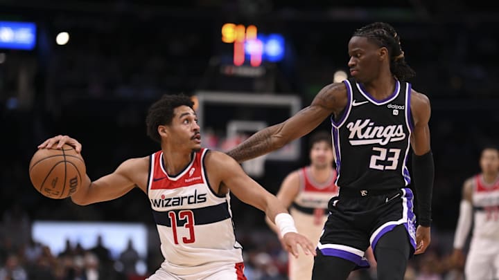 Mar 21, 2024; Washington, District of Columbia, USA; Washington Wizards guard Jordan Poole (13) dribbles as Sacramento Kings guard Keon Ellis (23) defends during the second half at Capital One Arena. Mandatory Credit: Tommy Gilligan-Imagn Images Mar 21, 2024; Washington, District of Columbia, USA; Washington Wizards guard Jordan Poole (13) dribbles as Sacramento Kings guard Keon Ellis (23) defends during the second half at Capital One Arena. Mandatory Credit: Tommy Gilligan-Imagn Images