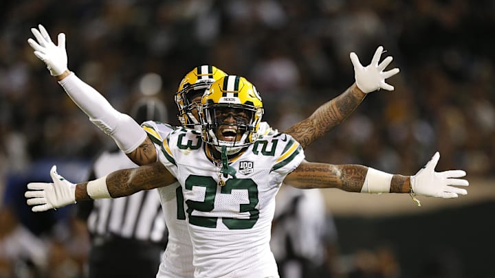 Aug 24, 2018; Oakland, CA, USA; Green Bay Packers cornerback Jaire Alexander (23) celebrates after intercepting a pass against the Oakland Raiders in the second quarter at Oakland Coliseum. Mandatory Credit: Cary Edmondson-Imagn Images