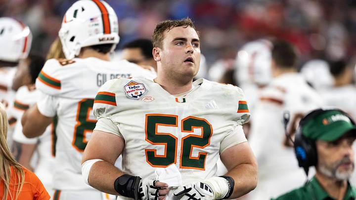 Jan 8, 2026; Glendale, AZ, USA; Miami Hurricanes offensive lineman James Brockermeyer (52) against the Mississippi Rebels during the 2026 Fiesta Bowl and semifinal game of the College Football Playoff at State Farm Stadium. Mandatory Credit: Mark J. Rebilas-Imagn Images