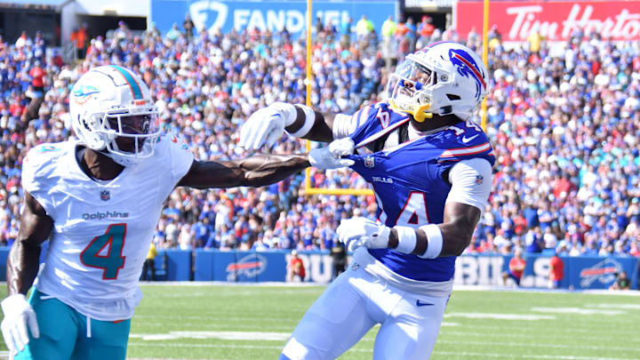 Oct 1, 2023; Orchard Park, New York, USA; Buffalo Bills wide receiver Stefon Diggs (14) is held by