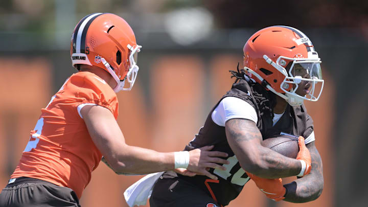 May 10, 2025; Berea, OH, USA; Cleveland Browns quarterback Dillon Gabriel (5) hands off to running back Quinshon Judkins (10) during rookie minicamp at CrossCountry Mortgage Campus. Mandatory Credit: Ken Blaze-Imagn Images