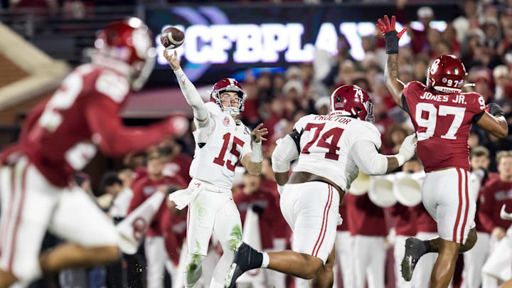 Dec 19, 2025; Norman, OK, USA; Alabama Crimson Tide quarterback Ty Simpson (15) and offensive lineman Kadyn Proctor (74) against Oklahoma Sooners defensive lineman Marvin Jones Jr. (97) during the CFP National Playoff First Round at Gaylord Family Oklahoma Memorial Stadium. Mandatory Credit: Mark J. Rebilas-Imagn Images