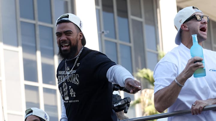 Los Angeles Dodgers outfielder Teoscar Hernandez (left) celebrates with fans during the Dodgers 2024 World Series Championship parade in downtown Los Angeles on Nov 1.