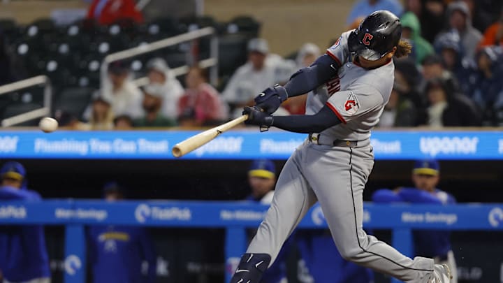 Sep 19, 2025; Minneapolis, Minnesota, USA; Cleveland Guardians catcher Bo Naylor (23) hits a two-run single against the Minnesota Twins in the first inning at Target Field. Mandatory Credit: Bruce Kluckhohn-Imagn Images