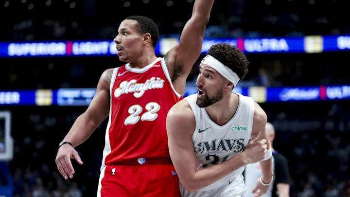 Mar 7, 2025; Dallas, Texas, USA;  Dallas Mavericks guard Klay Thompson (31) watches his shot go in as Memphis Grizzlies guard Desmond Bane (22) defends during the second half at American Airlines Center. Mandatory Credit: Kevin Jairaj-Imagn Images