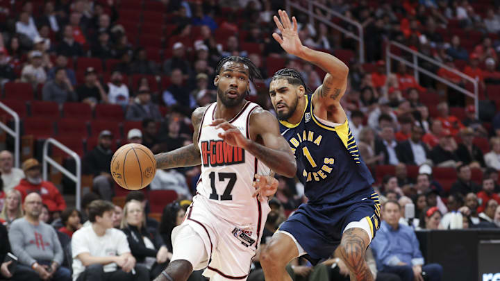 Nov 20, 2024; Houston, Texas, USA; Houston Rockets forward Tari Eason (17) drives with the ball as Indiana Pacers forward Obi Toppin (1) defends during the first quarter at Toyota Center. Mandatory Credit: Troy Taormina-Imagn Images