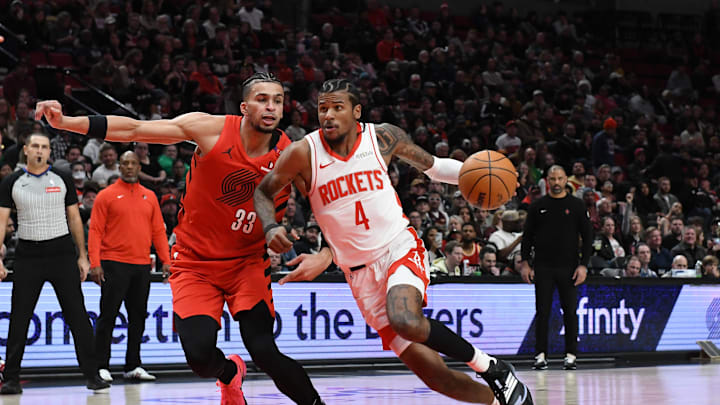 Jan 18, 2025; Portland, Oregon, USA; Houston Rockets guard Jalen Green (4) drives to the hoop against Portland Trail Blazers forward Toumani Camara (33) during the first half at Moda Center. Mandatory Credit: Brian Murphy-Imagn Images