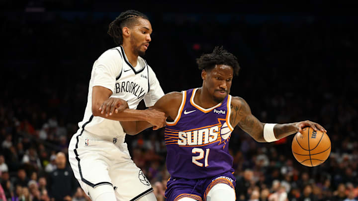 Jan 27, 2026; Phoenix, Arizona, USA; Phoenix Suns forward Nigel Hayes-Davis (21) drives to the basket against Brooklyn Nets forward Ziaire Williams (1) in the first half at Mortgage Matchup Center. Mandatory Credit: Mark J. Rebilas-Imagn Images Jan 27, 2026; Phoenix, Arizona, USA; Phoenix Suns forward Nigel Hayes-Davis (21) drives to the basket against Brooklyn Nets forward Ziaire Williams (1) in the first half at Mortgage Matchup Center. Mandatory Credit: Mark J. Rebilas-Imagn Images