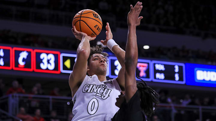 Jan 21, 2025; Cincinnati, Ohio, USA; Cincinnati Bearcats guard Dan Skillings Jr. (0) shoots against the Texas Tech Red Raiders in the first half at Fifth Third Arena. Mandatory Credit: Katie Stratman-Imagn Images Jan 21, 2025; Cincinnati, Ohio, USA; Cincinnati Bearcats guard Dan Skillings Jr. (0) shoots against the Texas Tech Red Raiders in the first half at Fifth Third Arena. Mandatory Credit: Katie Stratman-Imagn Images