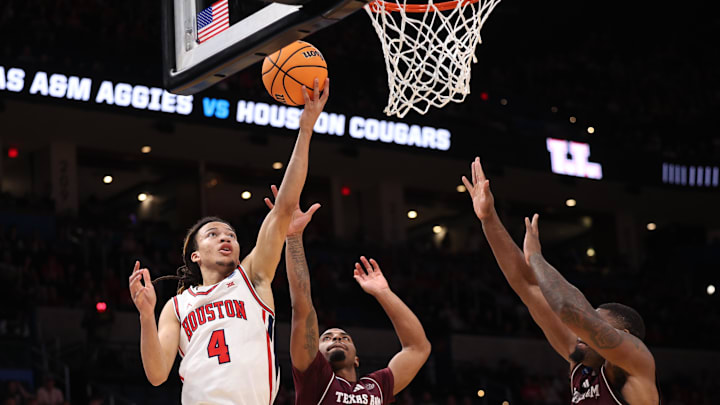 Mar 21, 2026; Oklahoma City, OK, USA; Houston Cougars guard Kingston Flemings (4) drives to the hoop past Texas A&M Aggies guard Marcus Hill (0) and forward Rashaun Agee (12) during the first half of a second round game of the men's 2026 NCAA Tournament at Paycom Center. Mandatory Credit: William Purnell-Imagn Images