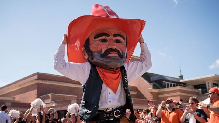 Oct 14, 2017; Stillwater, OK, USA; Oklahoma State Cowboys mascot Pistol Pete motions to the crowd during the walk prior to the game against the Baylor Bears at Boone Pickens Stadium. Mandatory Credit: Rob Ferguson-Imagn Images